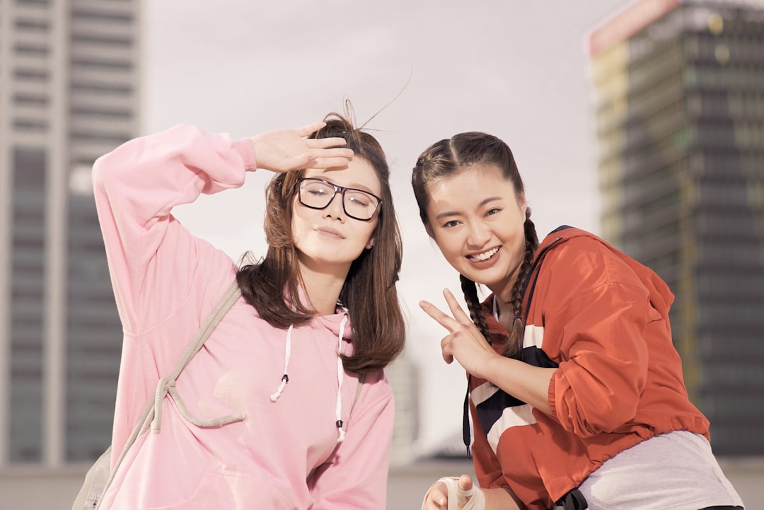 two-women-taking-selfie-outdoor-4vjigu1cv-c